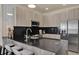 Modern kitchen featuring an island with bar seating, stainless steel appliances, and sleek cabinetry at 17441 Hidden Forest Dr, Clermont, FL 34714