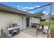 Outdoor patio featuring a grill, shaded dining area, and bench at 1785 6Th Ave, Deland, FL 32724