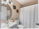 Charming bathroom with round mirror and decorative wall art at 1785 6Th Ave, Deland, FL 32724