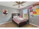 Cozy bedroom with neutral paint, a comfortable bed, and personal decorations at 1785 6Th Ave, Deland, FL 32724