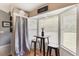 Cozy breakfast nook with a small table, stools, and ample natural light from surrounding windows at 1785 6Th Ave, Deland, FL 32724