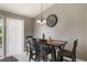 Bright dining area with a dark wood table, stylish chandelier, and views to the outside at 1785 6Th Ave, Deland, FL 32724