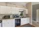 Functional kitchen with white cabinets, modern appliances, and ample counter space for cooking and food prep at 1785 6Th Ave, Deland, FL 32724