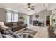 Open-concept living and dining area with gray walls, tile flooring, and modern furnishings at 1785 6Th Ave, Deland, FL 32724