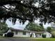 Charming one-story home with a beautiful oak tree in the front yard providing shade at 1809 Pepperidge Dr, Orlando, FL 32806