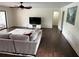 Bright living room with hardwood floors, modern decor, and a large window for natural light at 1809 Pepperidge Dr, Orlando, FL 32806