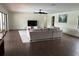Spacious living room featuring modern flooring, a ceiling fan and a large sliding glass door at 1809 Pepperidge Dr, Orlando, FL 32806