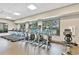 Well-equipped gym featuring treadmills, ellipticals, and a stationary bike with views of the pool area at 1845 Fulfillment Dr, Kissimmee, FL 34744