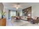 Bright living room with contemporary decor, ample seating, and stylish accents at 1852 Clear Sky Dr, Kissimmee, FL 34744