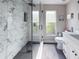 Well-lit bathroom features modern fixtures, a glass-enclosed shower, and a sleek vanity at 224 Hammock Dunes Pl, Orlando, FL 32828