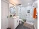 Renovated bathroom featuring a walk-in shower, vanity with sink, and modern fixtures at 224 Hammock Dunes Pl, Orlando, FL 32828
