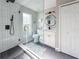 Bright bathroom showcasing modern design with sleek fixtures, glass shower enclosure and a vanity at 224 Hammock Dunes Pl, Orlando, FL 32828