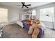 A bedroom with a bunkbed, a plush chair, and plenty of sunshine at 224 Hammock Dunes Pl, Orlando, FL 32828