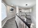 Hallway featuring art, recessed lighting, a staircase, and access to other rooms at 224 Hammock Dunes Pl, Orlando, FL 32828