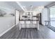 Bright kitchen featuring stainless steel appliances, granite countertops, a kitchen island, and an open floor plan at 224 Hammock Dunes Pl, Orlando, FL 32828