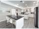 Modern kitchen featuring a center island, stainless steel appliances, and ample cabinet space at 224 Hammock Dunes Pl, Orlando, FL 32828