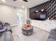 Living room featuring an entertainment center, couches, a ceiling fan, and access to other rooms at 224 Hammock Dunes Pl, Orlando, FL 32828
