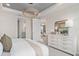 The bedroom features access to the ensuite bathroom and a living area with modern decor and lots of light at 2334 Daisy Tree Rd, St Cloud, FL 34771