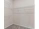 Empty walk-in closet with basic wire rack shelving and carpet at 2334 Daisy Tree Rd, St Cloud, FL 34771