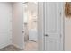 Convenient laundry room with a modern washer and dryer, storage cabinet, and stylish decor at 2334 Daisy Tree Rd, St Cloud, FL 34771