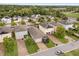 Picturesque neighborhood showcases diverse homes, long driveways and landscaped yards at 2417 Liner Ave, Apopka, FL 32703
