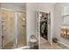 Primary bathroom with a tiled shower and adjacent walk-in closet for convenience at 2417 Liner Ave, Apopka, FL 32703