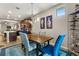Elegant dining area with a modern chandelier, comfortable seating, and stylish decor, great for Gathering meals at 2417 Liner Ave, Apopka, FL 32703