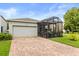 Charming home featuring an attached garage, screened in patio, and meticulously maintained landscaping at 2417 Liner Ave, Apopka, FL 32703