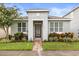 Charming single-story home with a well-manicured lawn, beautiful landscaping, and a welcoming entryway at 2417 Liner Ave, Apopka, FL 32703
