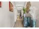 Hallway boasts wood floors, elegant décor, and recessed ceilings with natural light at 2417 Liner Ave, Apopka, FL 32703