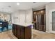 Bright kitchen with an island, stainless steel refrigerator, and seamless transition to the dining area, excellent layout at 2417 Liner Ave, Apopka, FL 32703