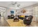 Inviting living room with a comfortable seating arrangement and elegant decor, creating a warm atmosphere at 2417 Liner Ave, Apopka, FL 32703