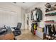 A home office also serves as closet space, with an organizational system for clothes and personal items at 2417 Liner Ave, Apopka, FL 32703