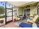 Cozy screened porch with comfortable seating, ceiling fans, and views of the neighborhood at 2417 Liner Ave, Apopka, FL 32703