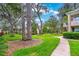 Relax on the manicured community lawn with mature trees and walking paths at 2500 Lee Rd # 243, Winter Park, FL 32789
