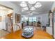 Open-concept layout with dining area flowing into living room, complemented by modern lighting and décor at 2500 Lee Rd # 243, Winter Park, FL 32789