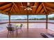Dock with a table and chairs, perfect for relaxing and enjoying the beautiful lake views at 2500 Lee Rd # 243, Winter Park, FL 32789