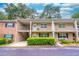 A two-story condo with covered balconies, front yard shrubbery and parking at 2500 Lee Rd # 243, Winter Park, FL 32789