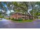 Attractive condo complex with brick facade, second-floor balconies, and well-maintained green spaces at 2500 Lee Rd # 243, Winter Park, FL 32789