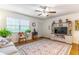 A well lit living room featuring updated ceiling fan, stylish furniture and home decor at 2500 Lee Rd # 243, Winter Park, FL 32789