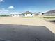 View of new construction home backyards, showcasing the building progress and potential outdoor space at 30166 Rustic Mill Street, Mount Dora, FL 32757