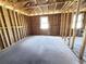 Unfinished bedroom with exposed framing, and window at 30166 Rustic Mill Street, Mount Dora, FL 32757