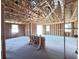 Interior framing with high ceilings, showcasing natural light, ready for customization and finishes at 30166 Rustic Mill Street, Mount Dora, FL 32757