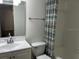 Bright bathroom featuring a modern vanity, mirror, and a shower with a stylish curtain at 3120 Plaza Terrace Dr # 3120, Orlando, FL 32803