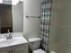 Bright bathroom featuring a modern vanity, mirror, and a shower with a stylish curtain at 3120 Plaza Terrace Dr # 3120, Orlando, FL 32803