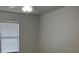 Bright bedroom with large window and blinds providing natural light at 3120 Plaza Terrace Dr # 3120, Orlando, FL 32803