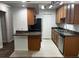 Well-lit kitchen with stainless steel appliances, granite counters, and ample cabinet space at 3120 Plaza Terrace Dr # 3120, Orlando, FL 32803