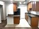 Bright kitchen featuring stainless steel appliances and modern lighting at 3120 Plaza Terrace Dr # 3120, Orlando, FL 32803