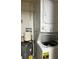 Convenient laundry area with a stacked washer and dryer unit and a water heater at 3120 Plaza Terrace Dr # 3120, Orlando, FL 32803