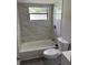 Well-lit bathroom featuring tiled shower and updated fixtures at 3187 Shady Willow Dr, Orlando, FL 32808